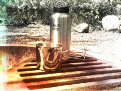 Stainless steel water bottle by Kleen Canteen and stainless steel cup with collapsible handle. Perfect companions for making potable water!